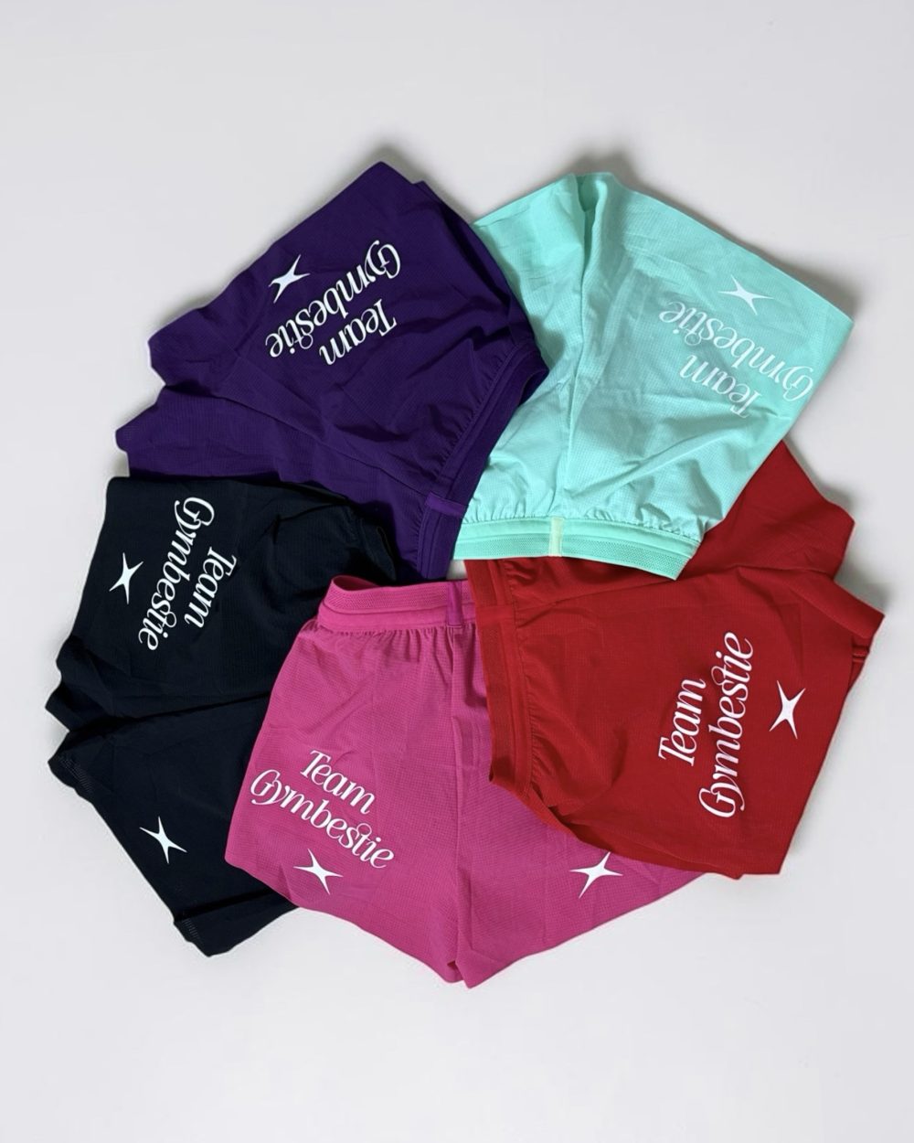 TEAM GYMBESTIE RUNNING SHORTS